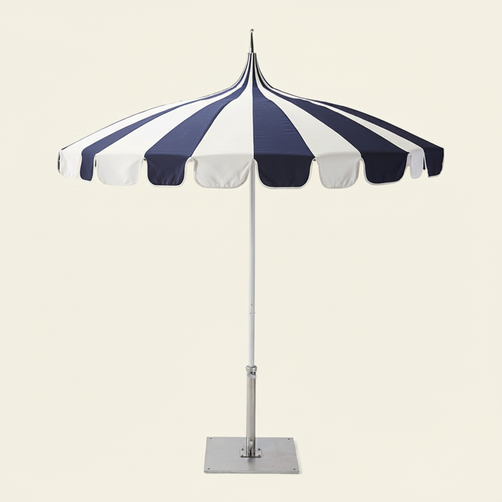 2.5M Riviera Luxe Outdoor Patio Umbrella in blue and white open over a patio setting