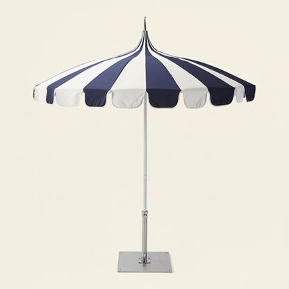 2.5M Riviera Luxe Outdoor Patio Umbrella in blue and white open over a patio setting