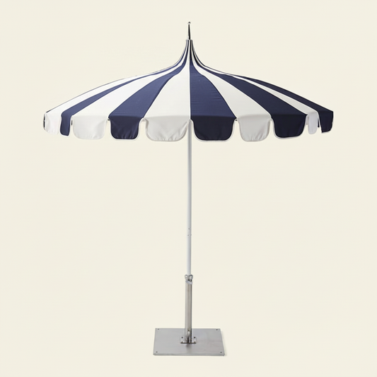 2.5M Riviera Luxe Outdoor Patio Umbrella in blue and white open over a patio setting